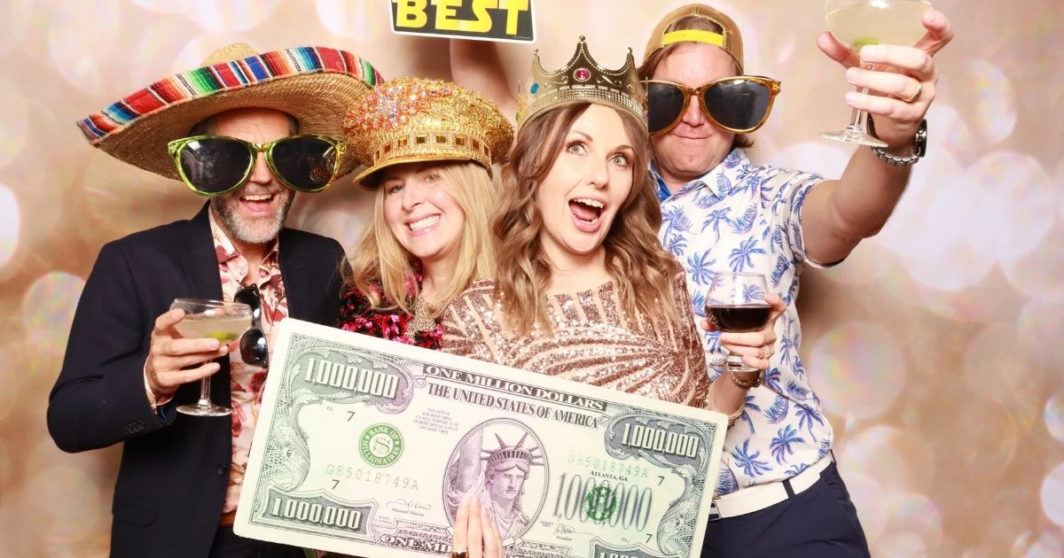 Premium Photo Booth Backdrop with Guests Posing with Props | CaptureME Photo Booth Rental Company in Windsor, CO | Weddings and Corporate Events in Northern Colorado