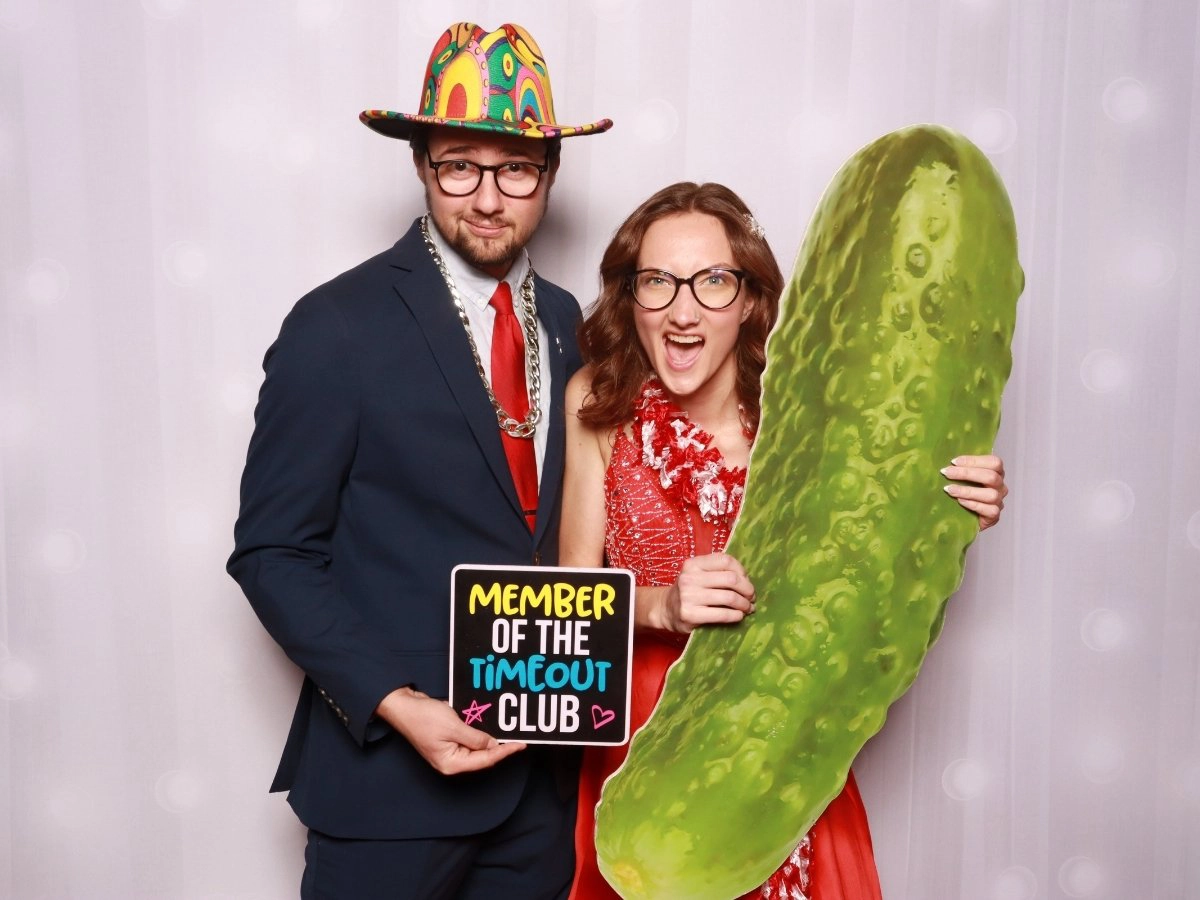 Guests posing in a Photo booth rental for a Corporate Gala in Loveland, Colorado