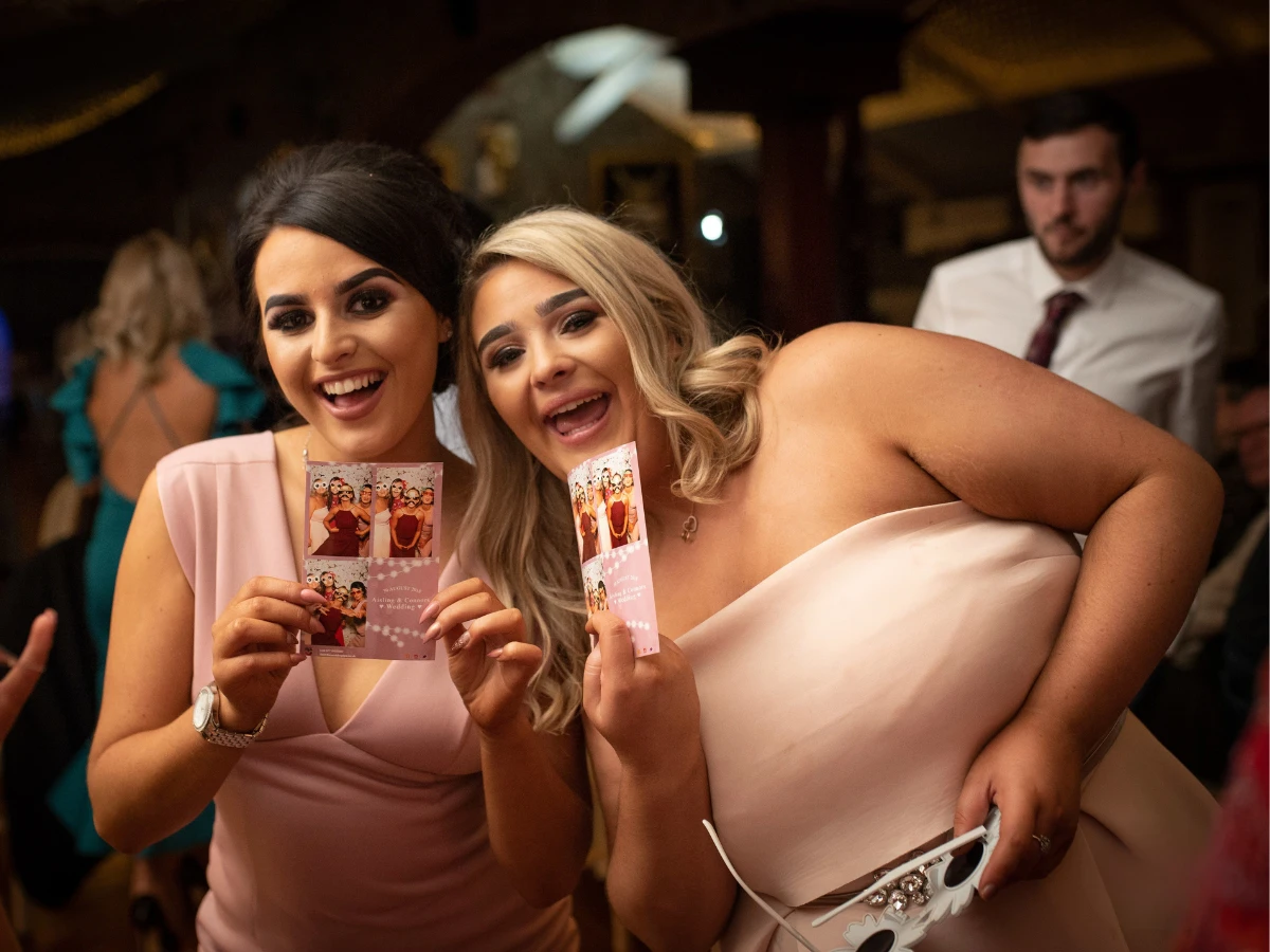 Guests laughing and taking photos during a private event in Windsor, CO