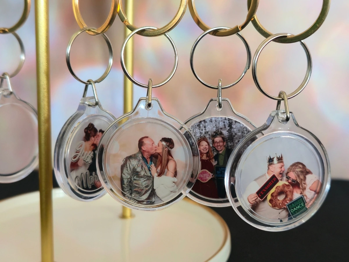Custom photo keychains created during a Fort Collins wedding reception