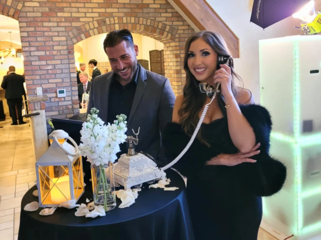 Wedding guests leaving messages on audio guest book phone at Della Terra reception in Estes Park CO