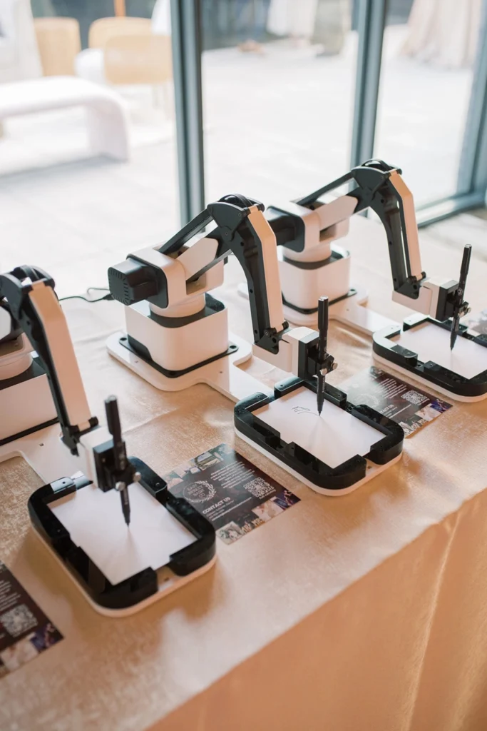 Live robot drawing booth creating a guest portrait at a Colorado event