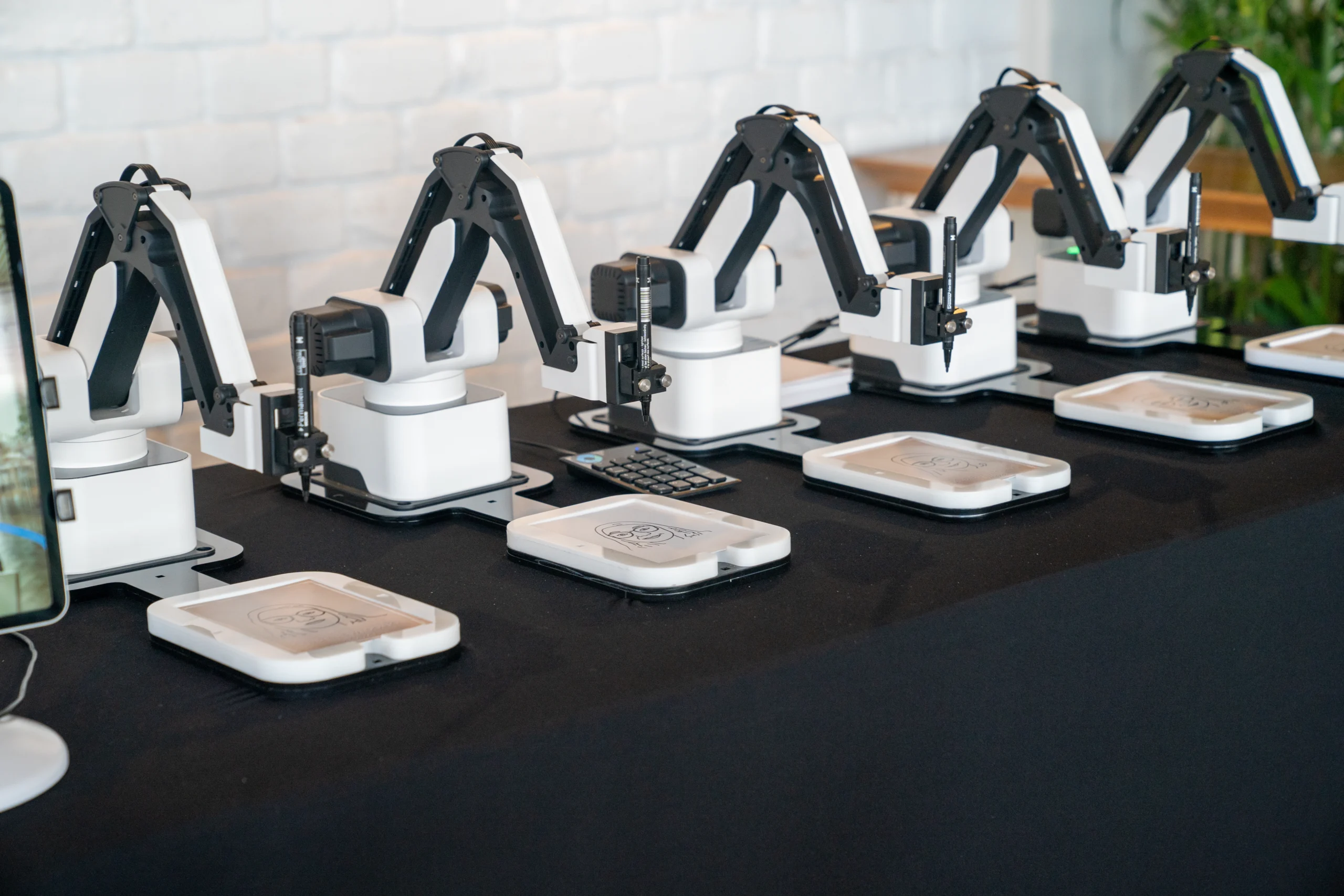 Draw ME Bot creating custom robotic AI sketches live for Colorado events
